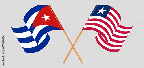 Crossed and waving flags of Cuba and Liberia