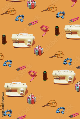 Creative sewing pattern with threads,  scissors, measuring tape and machine . DIY background idea.Personal inventiveness.