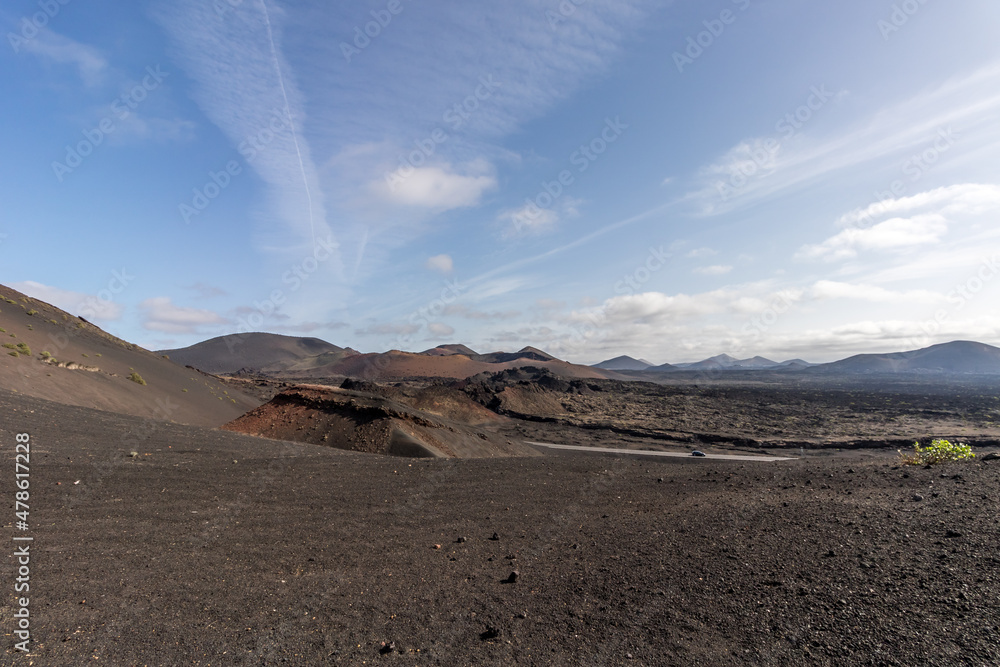 Timanfaya national park a vulcanic landscape surrounded by and mountains and vulcanicn rocks , at Lanzarote, Canary islands. Spain.