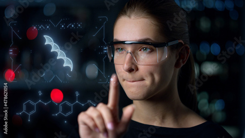 Digital glasses woman biochemist inspecting DNA hologram looking for deviations photo