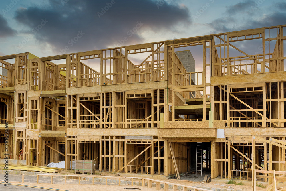 Fragment of a new home under construction wood framing beams