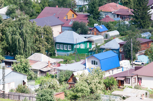 Several residential buildings in the Russian village in the summer