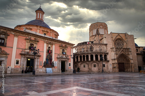 VALENCIA , SPAIN - DECEMBER 6, 2021: Square of Saint Mary's with Valencia Cathedral Temple, Basilica de la nuestra senora de los desamparados and the rio tura fountain in old town.