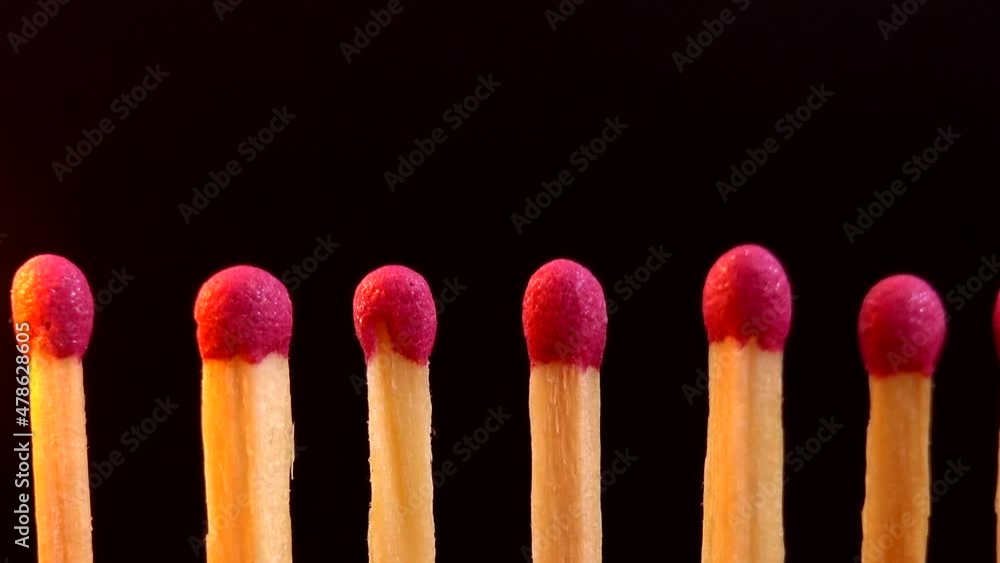 Burning matches on a black background. Burning matches on a black background.