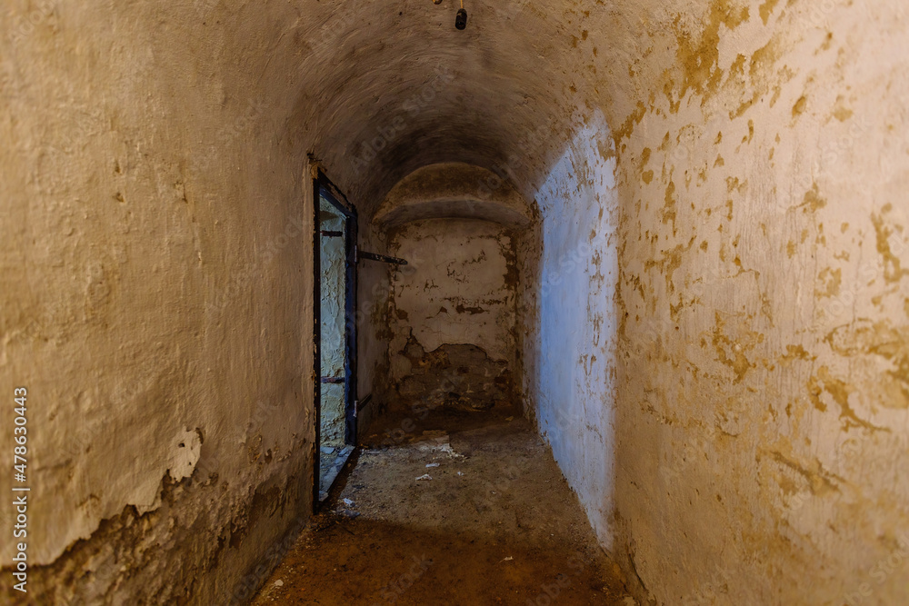 Abandoned empty old dark underground vaulted cellar
