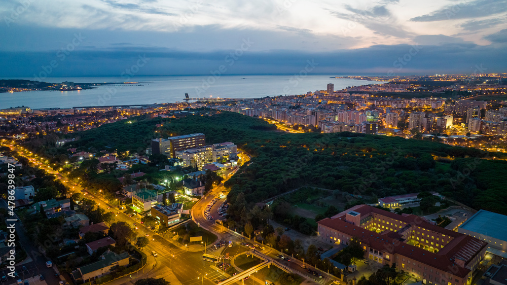 Obraz premium Lisbon cityscape during the night, aerial photo, drone.