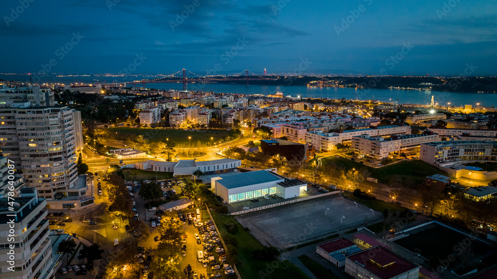 Obraz premium Lisbon cityscape during the night, aerial photo, drone.