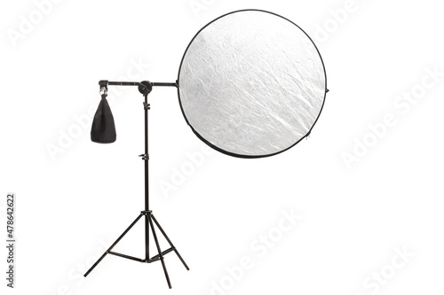 Bild auf Leinwand Round silver fabric reflector on stand with counterweight bag