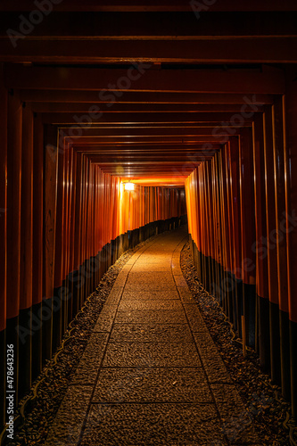 The Senbon Torii, Thousands Torii Gate, at Fushimi Inari Taisha Shinto shrine at night.
