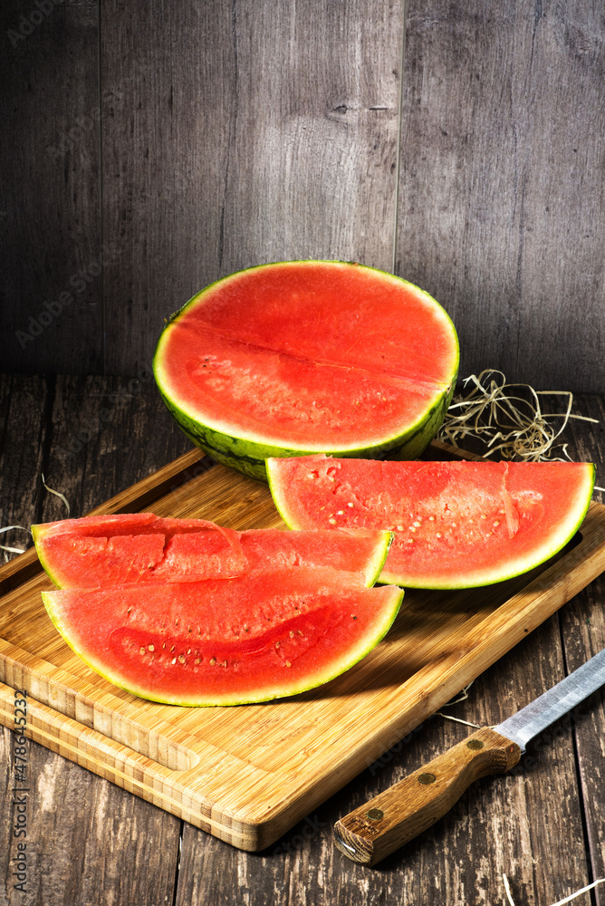 Ripe watermelon cut into pieces on the table. Ripe watermelon cut into pieces on the table.