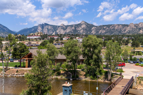 Estes Park - A sunny Summer day view of the center of the mountain resort town Estes Park at side of Big Thompson River. Colorado, USA. photo