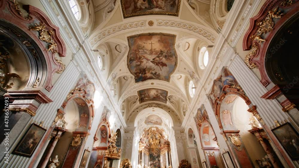 Symmetrical shot of the interior of a beautiful Catholic Church in Europe Symmetrical shot of the interior of a beautiful Catholic Church in Europe