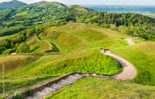 Walkers enjoy the Malvern Hills during a summer sunrise.