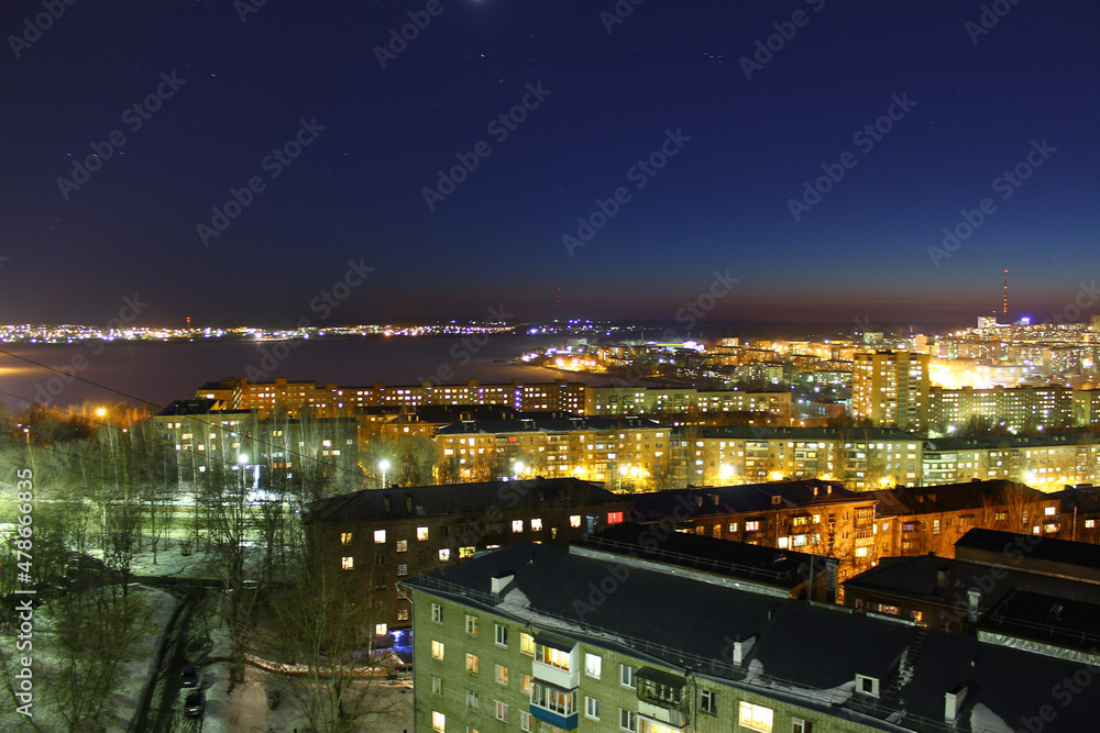 view of high-rise buildings in the city at night view of high-rise buildings in the city at night