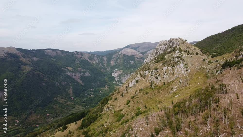 Fascinating view of the mountainous terrain of the country. Part of the mountains is covered with forest. Aerial view of Montenegro mountains. Fascinating view of the mountainous terrain of the country. Part of the mountains is covered with forest. Aerial view of Montenegro mountains.
