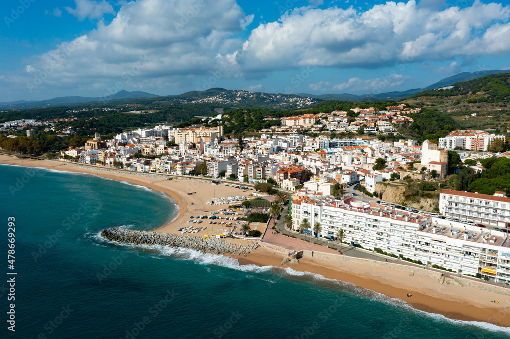Aerial photo of Spanish municipality Sant Pol de Mar with view of beach and residential buildings.