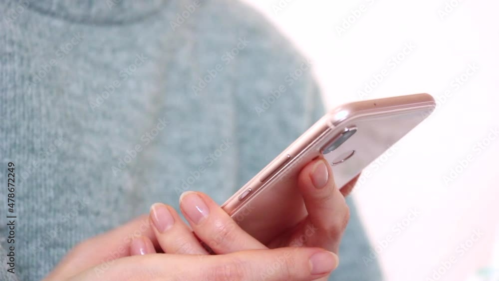 Closeup shot of the young woman using the smartphone. Closeup shot of the young woman using the smartphone.
