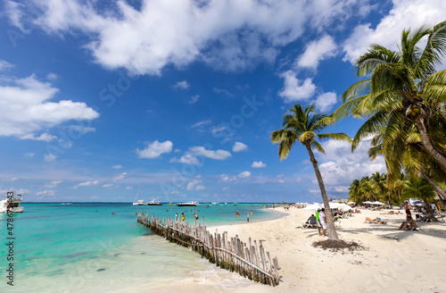 Serene turquoise Isla Mujeres beach Playa Norte famous for emerald waters  sandy sea shore and beach bars for fun and beach parties.