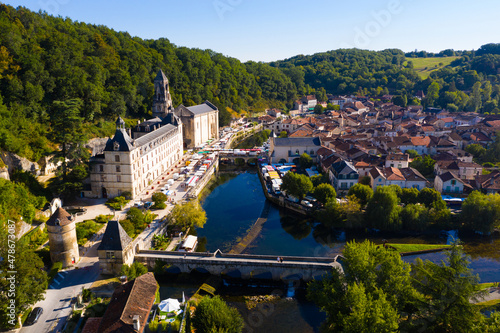 Vászonkép Scenic drone view of Brantome en Perigord on Dronne river with former Benedictine abbey on sunny summer day, Dordogne, France