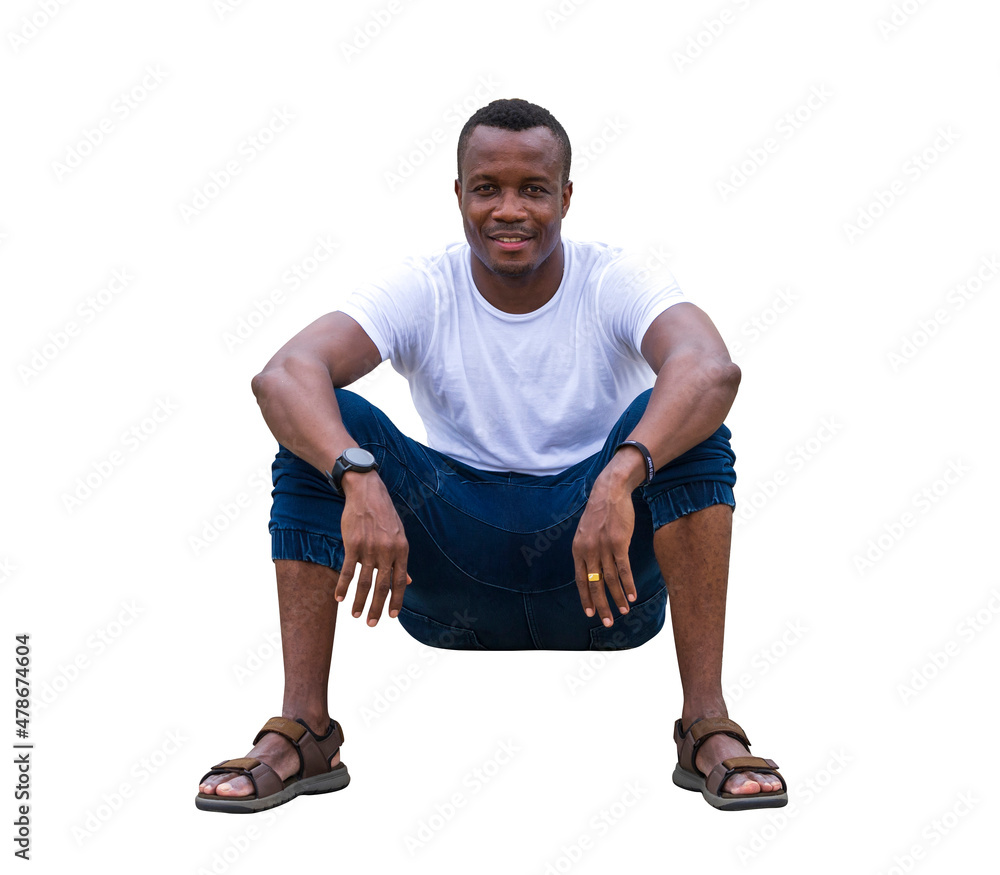 Healthy African American man sitting on the ground in relaxation with white t-shirt and jeans pant isolated on white background with clipping path Healthy African American man sitting on the ground in relaxation with white t-shirt and jeans pant isolated on white background with clipping path