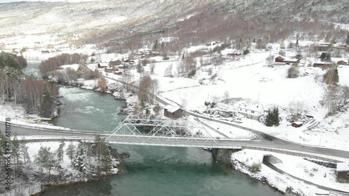 Road Bridge Over Otta River At Winter. Donfoss River View In Norway. aerial orbit photo
