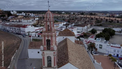 Aerial view of Ayamonte from the Parroquia del Salvador, Spain. Amazing blue sky with streaked clouds. View over the Guadiana River Vila Real Santo Antonio, Portugal from the other side of the bank photo