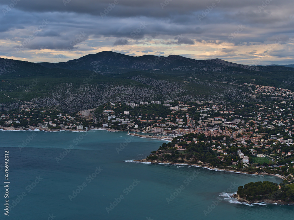 Aerial view of the French Riviera with small town Cassis at the mediterranean coast on cloudy day in autumn viewed from the top of cliffs Falaises.