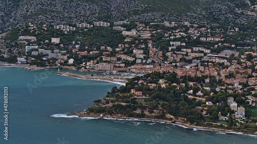 Aerial view of small fishing village Cassis, French Riviera at the mediterranean coast viewed from the top of Cap Canaille with historic port. © Timon