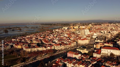 Aerial view of Aveiro city center in Portugal during sunset golden hours with his canal and boat