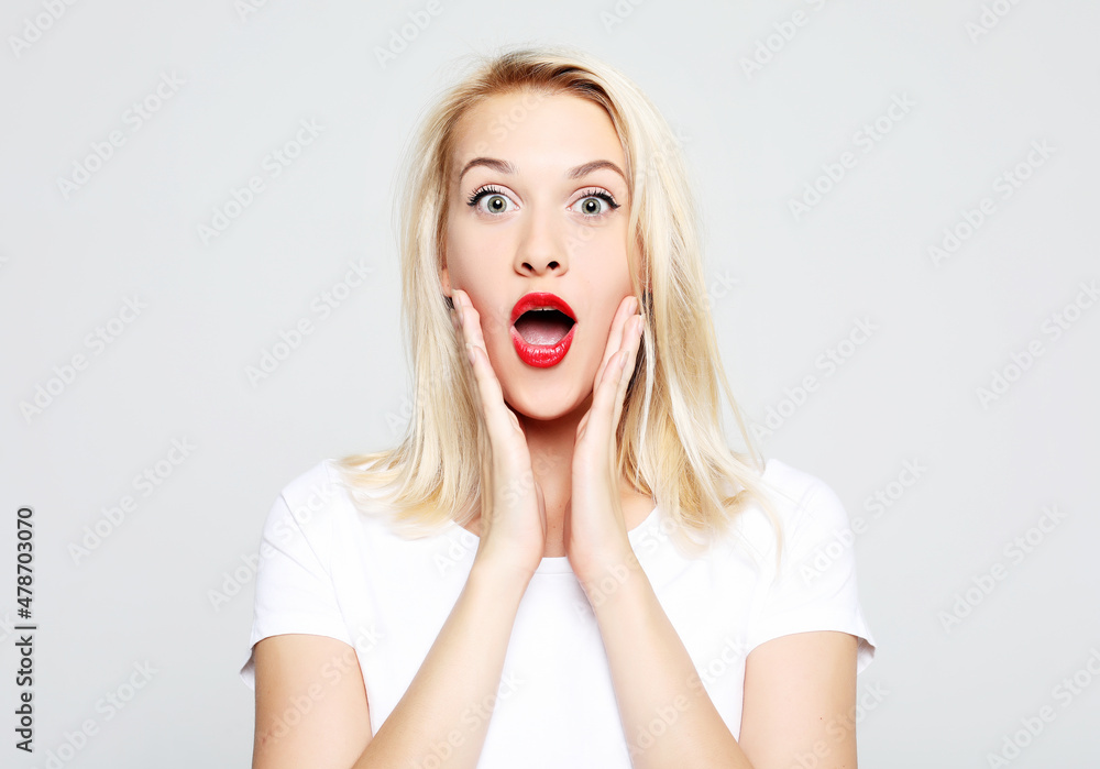 Beautiful girl surprised and shocked looks on you. Beautiful girl surprised and shocked looks on you.