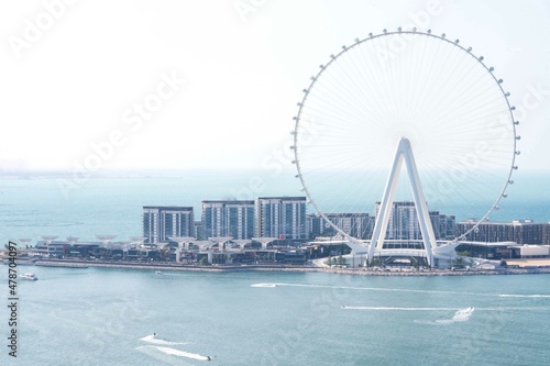 Dubai Eye Ferris wheel against blue sky © sashapritchard
