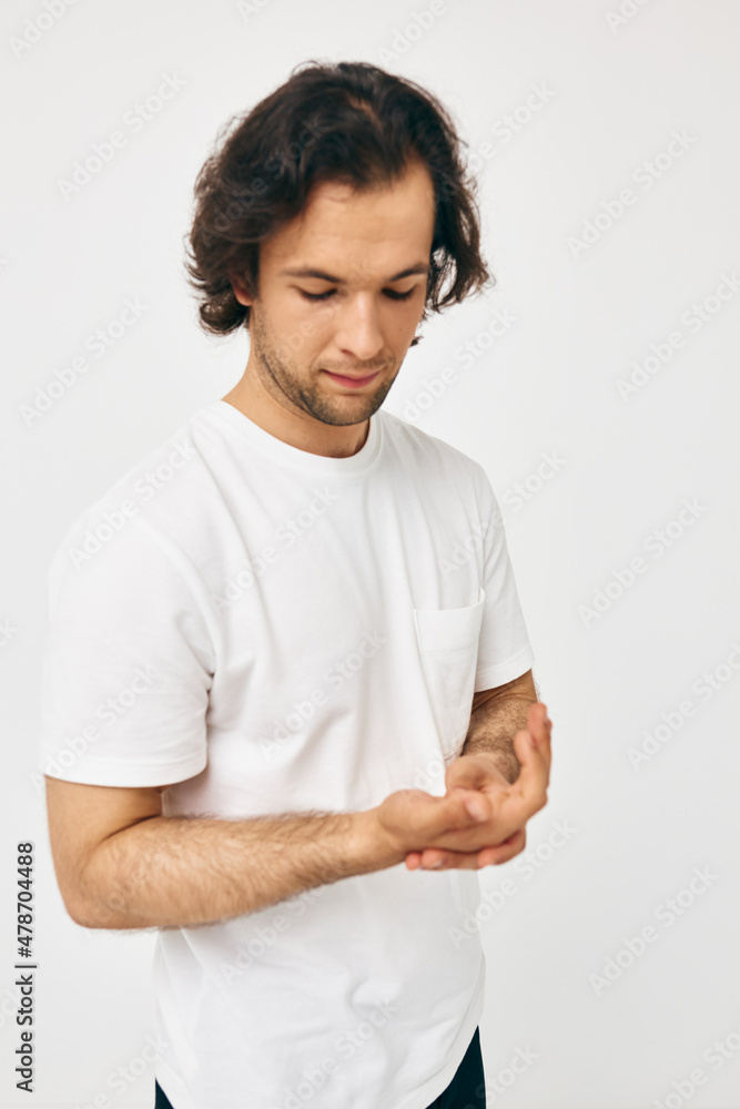 handsome man in a white T-shirt hand gesture isolated background handsome man in a white T-shirt hand gesture isolated background