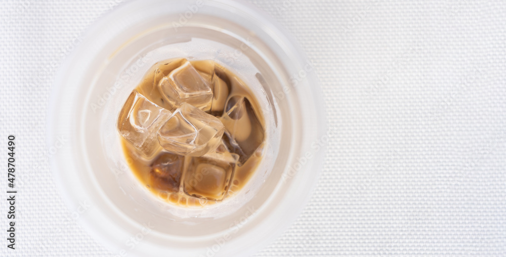 Iced coffee on a beach lounger, top view Iced coffee on a beach lounger, top view