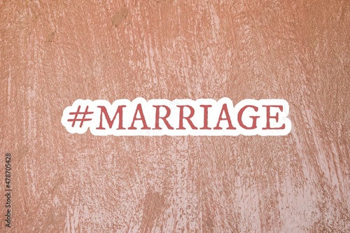 Hashtag marriage inscription on plastered wall background. photo
