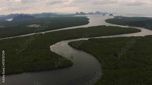 Wallpaper Mural 4k Aerial Drone footage flying over mangroves and lush rainforest in Phangnga bay Thailand The view is of mountainous islands and dramatic orange sunrise over the ocean Torontodigital.ca