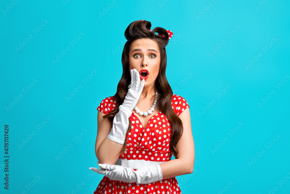 Emotional pinup woman in retro outfit over cannot believe amazing offer or sale, opening mouth in surprise Emotional pinup woman in retro outfit over cannot believe amazing offer or sale, opening mouth in surprise