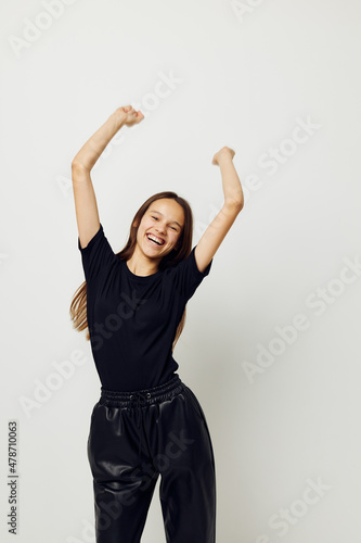athletic woman long hair black t-shirt emotion isolated background © Tatiana