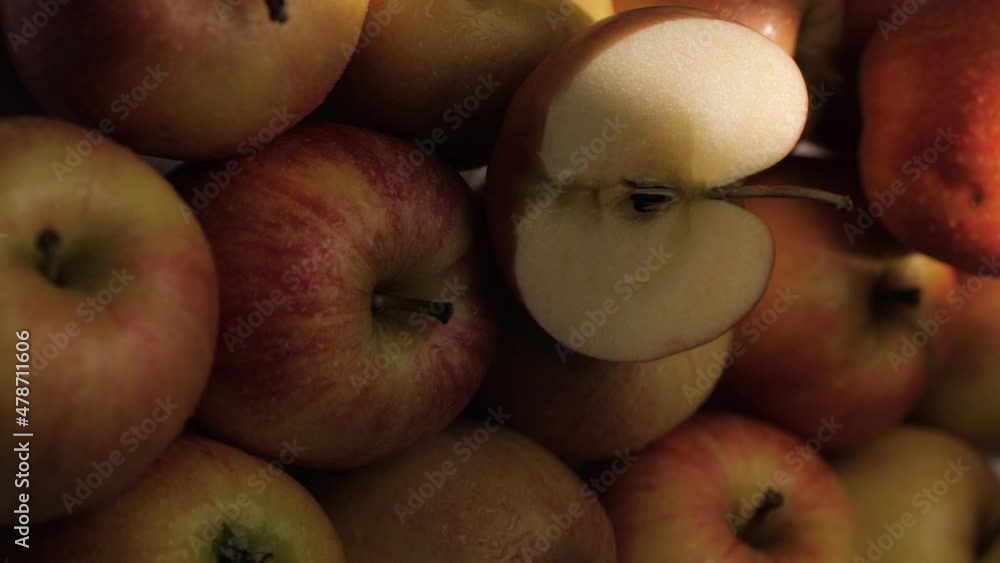 Apples fruit. Vertical video of sunbeam passes over fresh apples lying in shade Apples fruit. Vertical video of sunbeam passes over fresh apples lying in shade