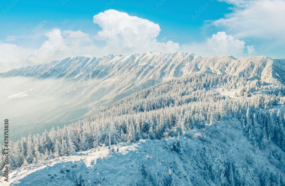 Obraz premium Climbing Piatra Mică Peak may be difficult, but the view from the top is beautiful. PPiatra Craiului National Park from Romania. People hiking in winter mountains for winter sport snow mountain hills