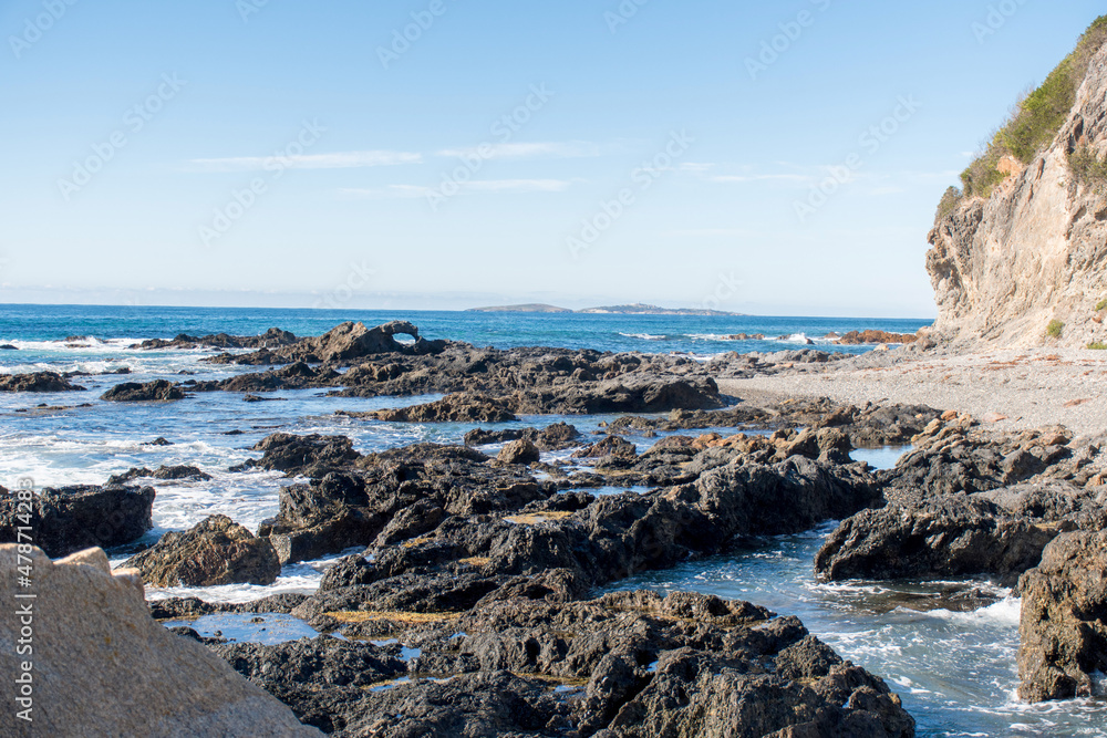 Rocks and pillow lava rock formation on the ocean shore. Travel destination. Narooma, NSW, Australia