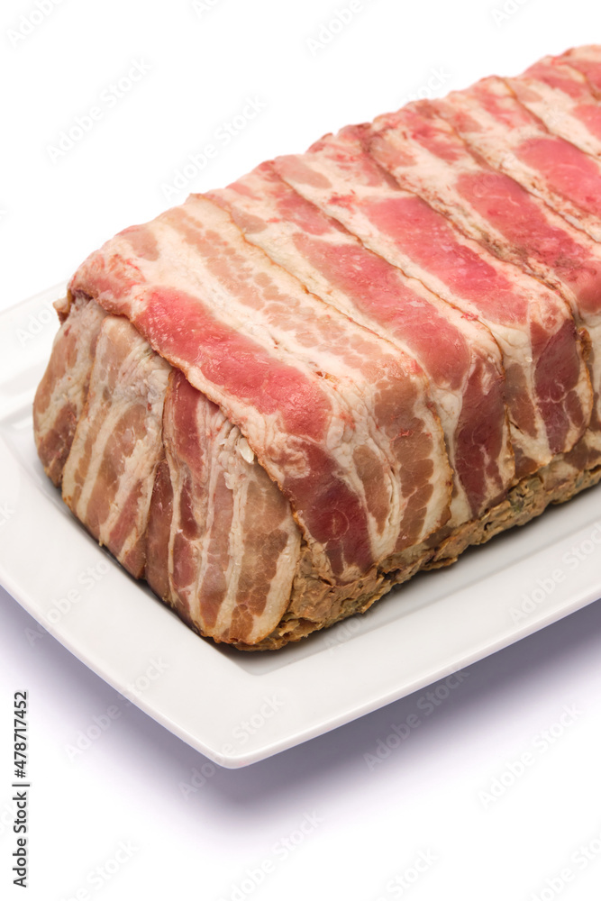 Traditional French terrine covered with bacon isolated on white background Traditional French terrine covered with bacon isolated on white background