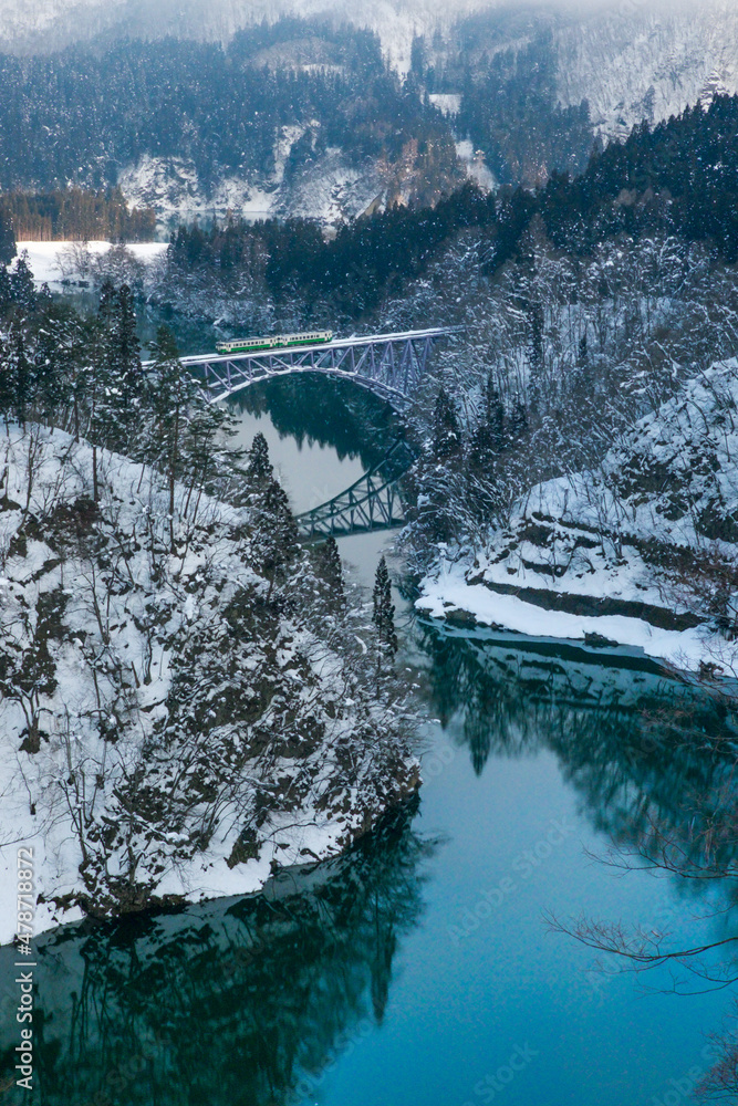 Tadami railway line and Tadami River in winter season at Fukushima