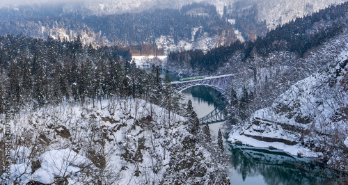 Tadami railway line and Tadami River in winter season at Fukushima prefecture.