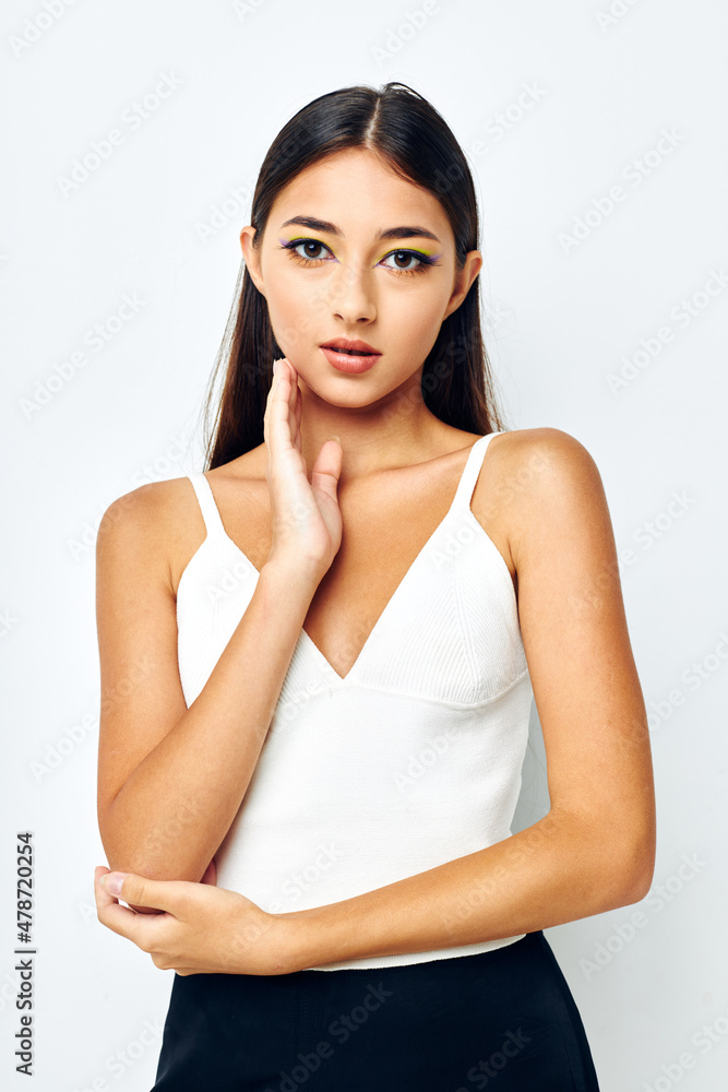 young woman attractive look fashion posing light background unaltered young woman attractive look fashion posing light background unaltered