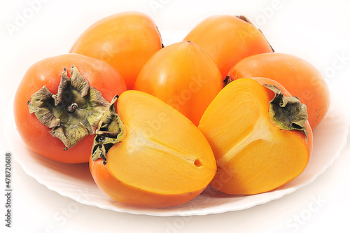 orange persimmon on a white plate