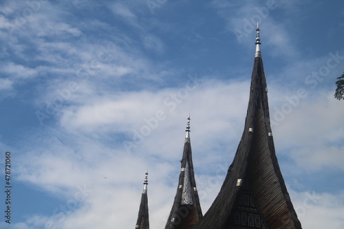 Roof of Minangkabau Traditional House (Rumah Gadang), West Sumatra, Indonesia on a cloudy sunny bright sky