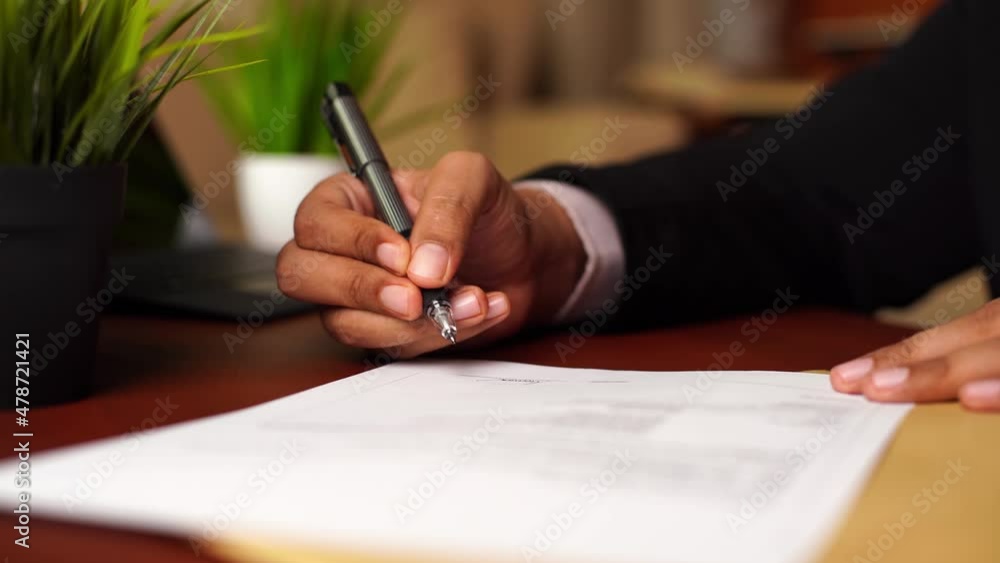 Businessman or CEO or Politician hands signing document or contract or agreement on the office desk. Businessman or CEO or Politician hands signing document or contract or agreement on the office desk.