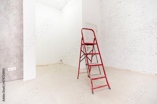 White staircase on a white background with a copy of the space. Minimal style. The concept of motivation, construction and repair.