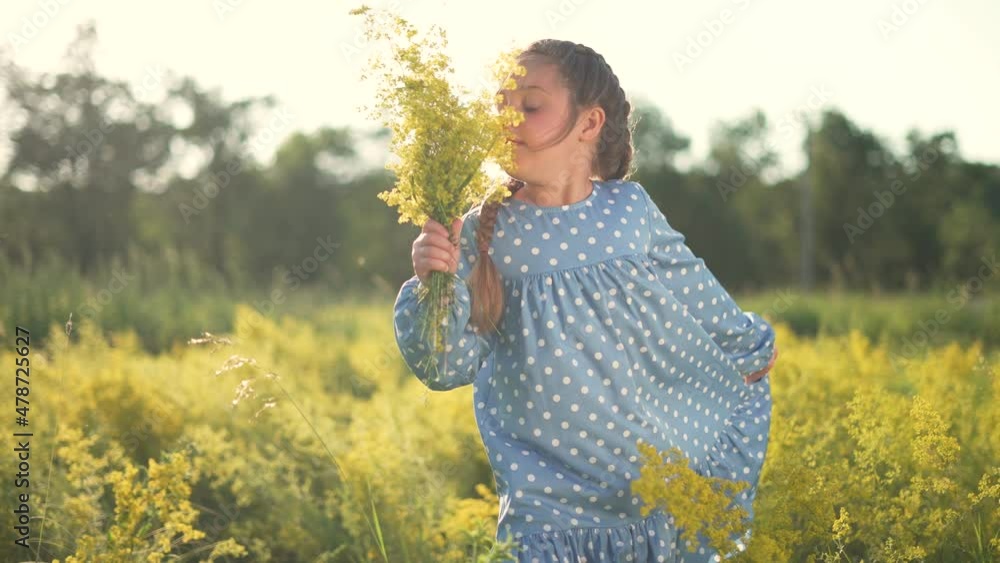 Happy child in field with flowers. Sunset in field with green grass. Girl's dream in spring in park. Natural park in summer. Child play in park in green grass. Happy little girl with flowers in meadow Happy child in field with flowers. Sunset in field with green grass. Girl's dream in spring in park. Natural park in summer. Child play in park in green grass. Happy little girl with flowers in meadow