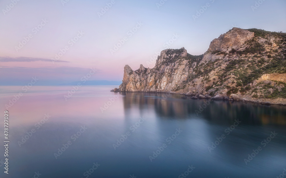 Pastel and picturesque landscape on a mountain reflecting the sea in the morning light. Beauty of nature concept. Soft colors of the morning dawn. Crimea. 